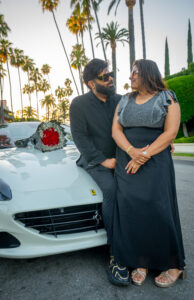 lovely-couple-in-palm-lined-street-romantic-moment-with-white-ferrari-and-boquet-of-flowers